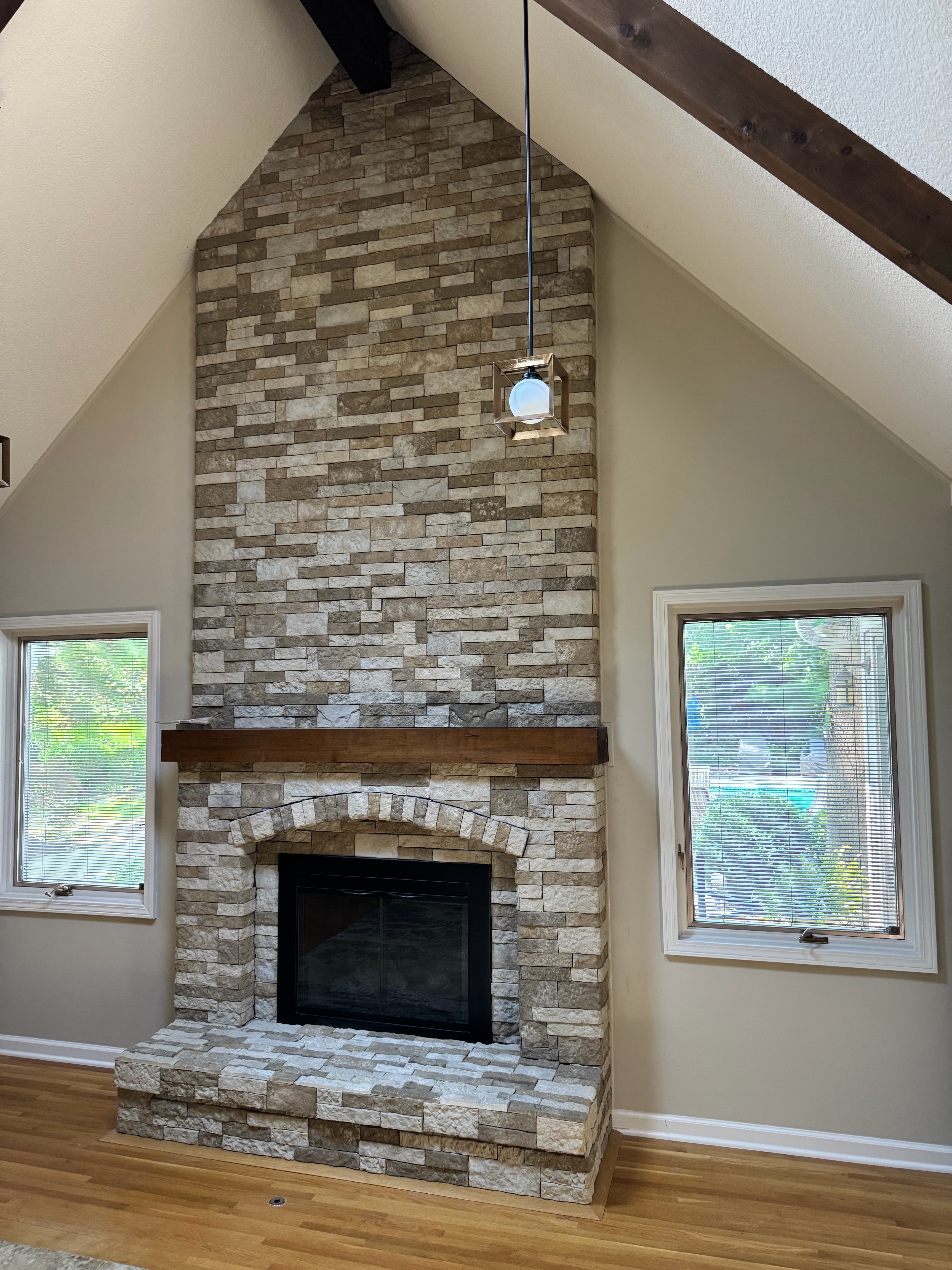 Floor-to-ceiling stone fireplace (vaulted)