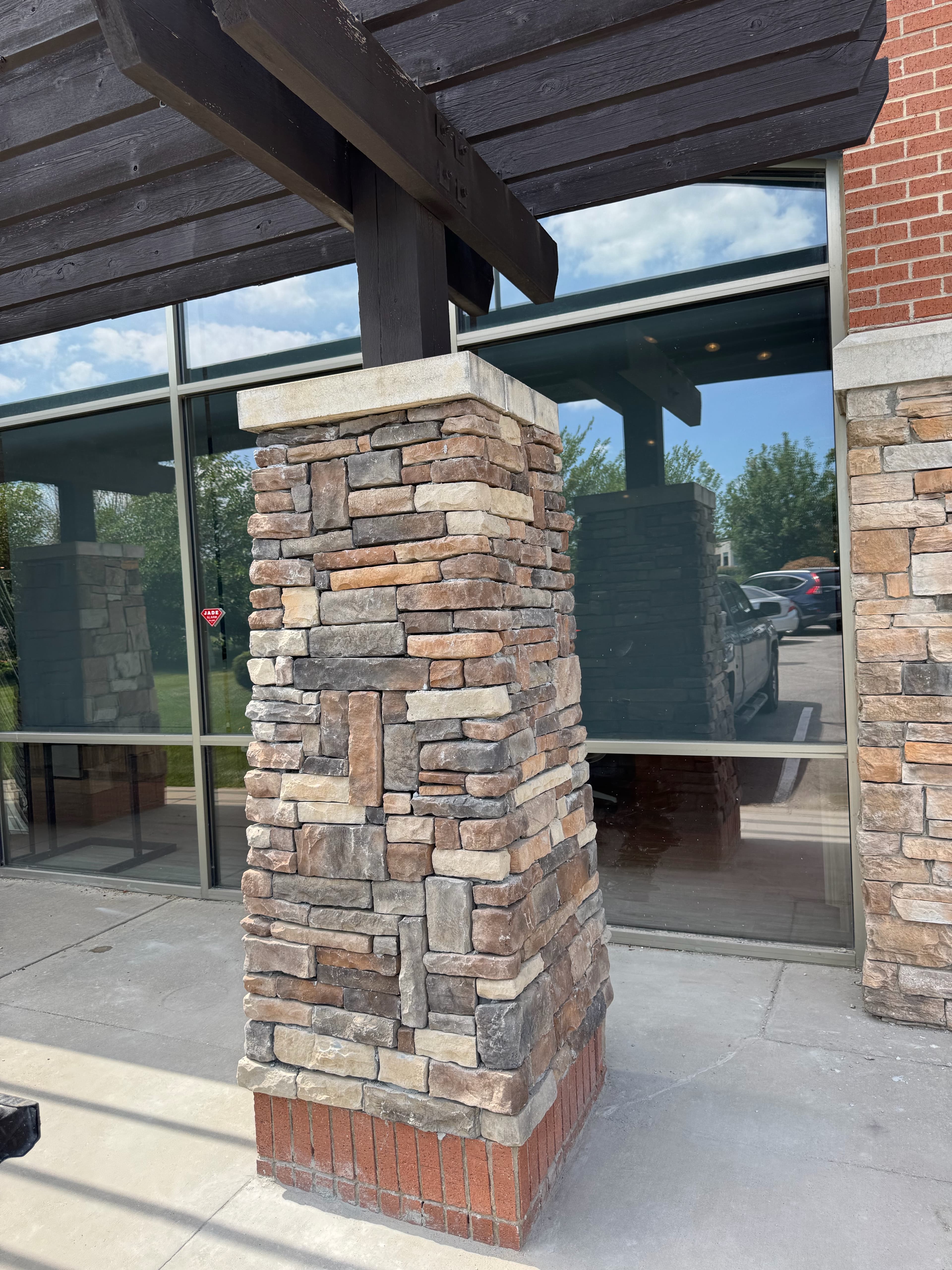 Commercial stone pillar with brick base